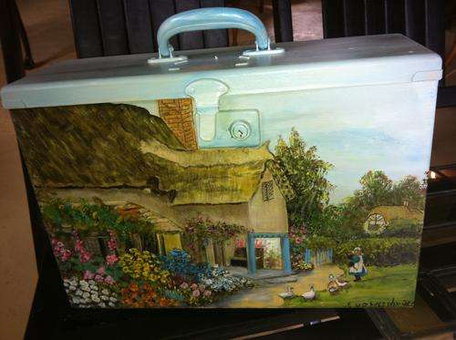 Pretty hand-painted cottage on Metal Suitcase