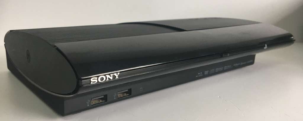 PlayStation 3 Super Slim 1TB + Controller And 6 Titles Good Condition! ( Original Box Not Included )