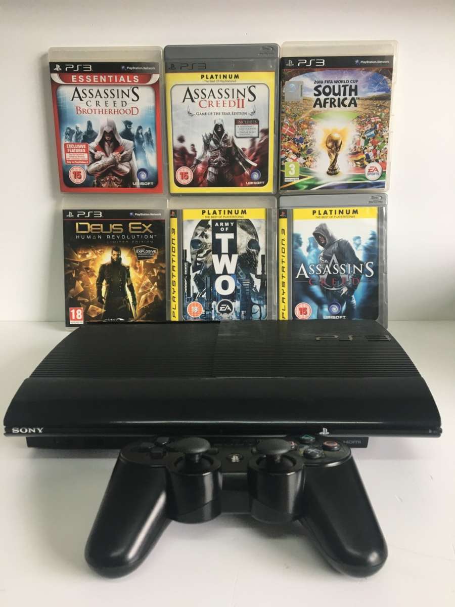PlayStation 3 Super Slim 1TB + Controller And 6 Titles Good Condition! ( Original Box Not Included )