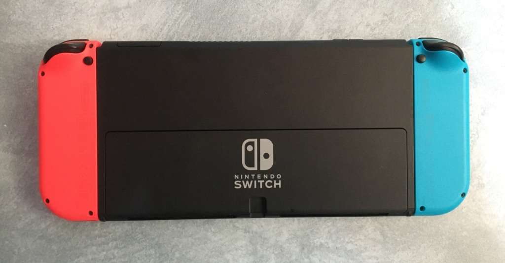 Nintendo Switch OLED Model HEG-001  64GB - Neon Red / Blue Boxed Great Condition!