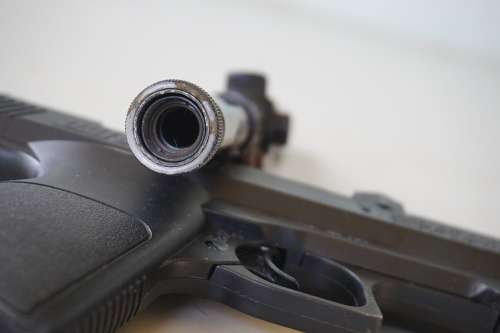 Vintage Daisy air pistol with toy rifle scope?