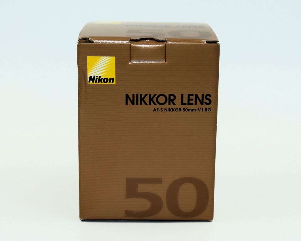 A new Nikon AF-S 50mm f/1.8G NIKKOR Lens + lens bag