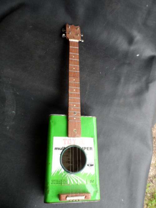 "BLIK GUITAR". HAND MADE. 4 STRING. NOTE: CONDITION.
