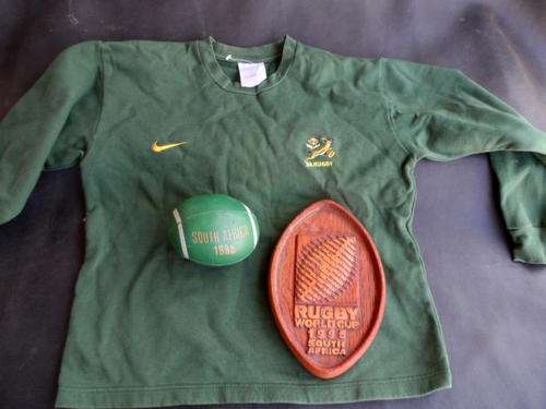 SOUTH AFRICAN SPRINGBOK RUGBY MEMORABILIA. 1995 FOAM RUGBY BALL. WOODEN PLAQUE. SPRINGBOK SWEATER.