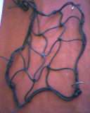 CAR NET FOR KEEPING THINGS FROM MOVING AROUND.