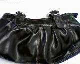 BLACK FAUX LEATHER HANDBAG WITH WHITE STITCHING. LINING AND ZIPS IN GOOD CONDITION.