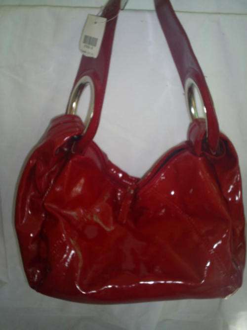 RED FASHION HANDBAG. NEW. BOUGHT IN CANADA.