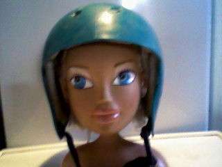 GREEN PROTECTIVE HEADGEAR/HELMET.