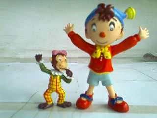 NODDY FIGURINE AND LITTLE GIRL MONKEY FIGURINE.SOME DAMAGE ON THE MONKEYS HAND BUT NODDY IS PERFECT.