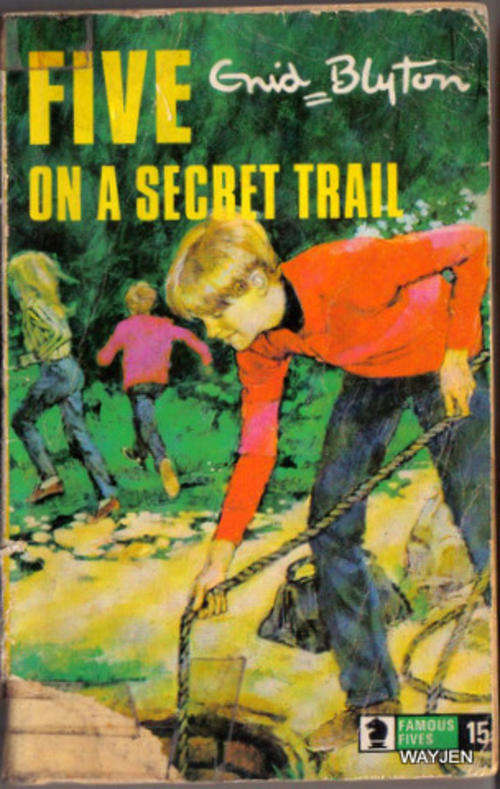 FIVE ON A SECRET TRAIL by ENID BLYTON. SOFT COVER. 158 PAGES. FRONT PAGED TAPED AND PAGES YELLOWED.
