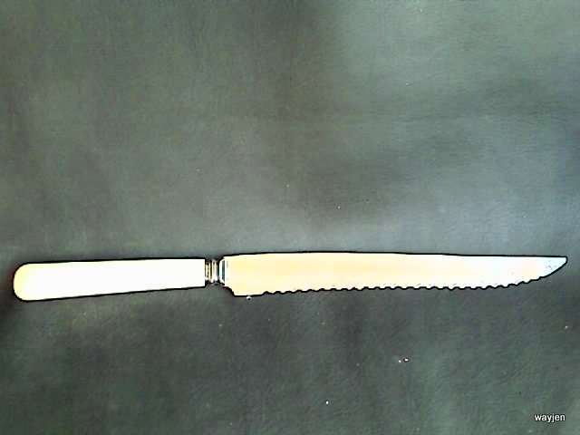 SHARP BREAD/CARVING KNIFE. NOT SURE IF IT'S BONE HANDLED. MADE IN SHEFFIELD ENGLAND. STAINLESS STEEL