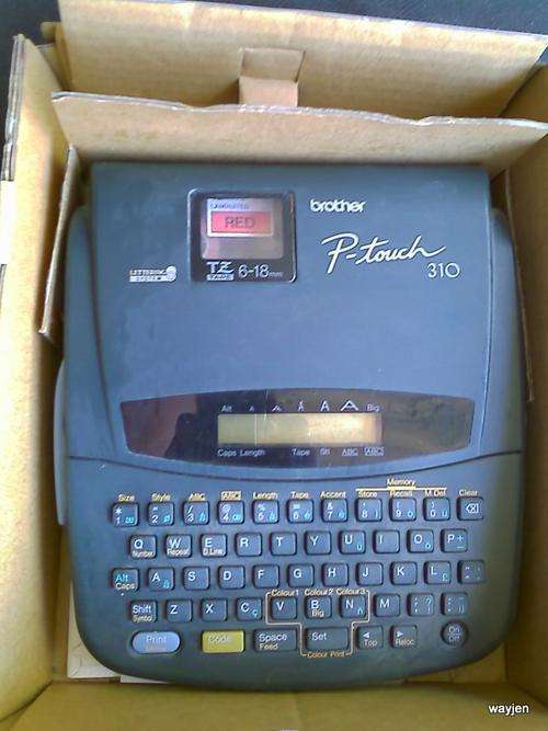 BROTHER P-TOUCH 310 LAMINATED LABEL MAKING MACHINE. WITH INSTRUCTION BOOK. MACHINE WORKS.