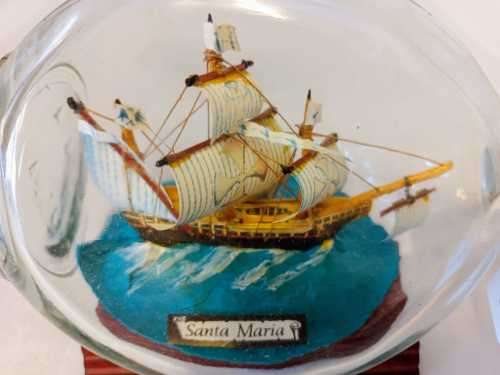 `SANTA MARIA` SHIP IN A BOTTLE FROM THE QUORN RANGE OF MODEL SHIPS on a wooden stand.