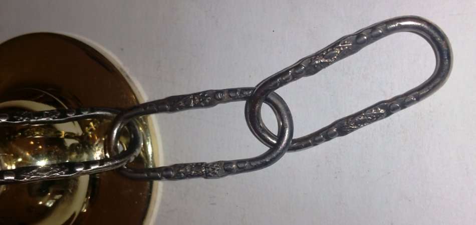 BRASS AND GILT TONE TWO ARM CHANDELIER WITH FROSTED GLASS SHADES