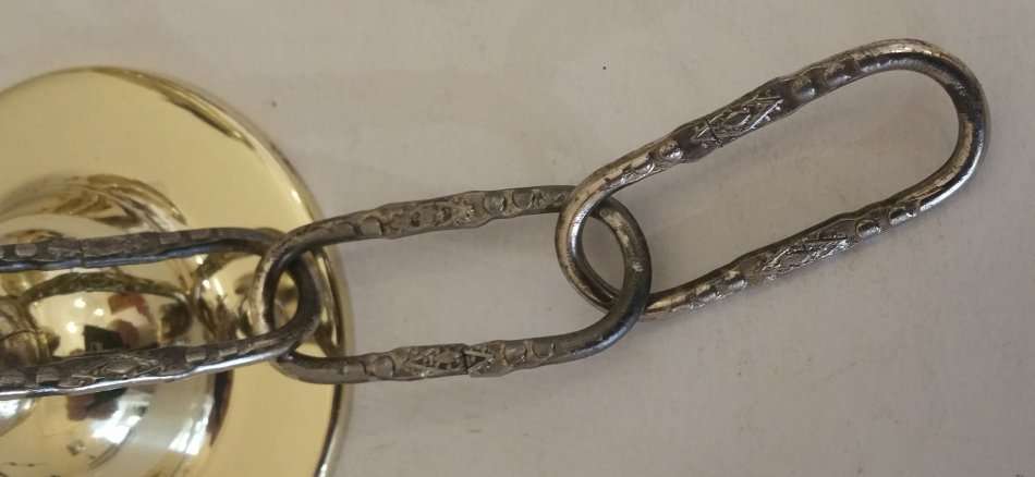 BRASS AND GILT TONE TWO ARM CHANDELIER WITH FROSTED GLASS SHADES