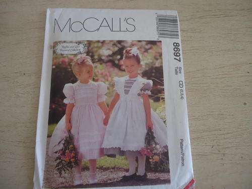 McCALL'S PATTERN NUMBER 8697 "RUFFLES & LACE" CHILD SIZE = CD = 2 +3 + 4 - COMPLETE AND UNCUT