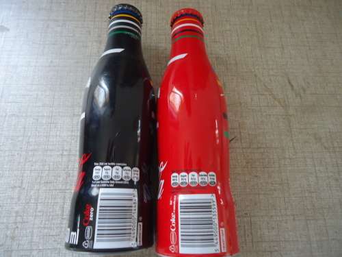 SET OF TWO OLYMPIC COCA COLA BOTTLES - SWIMMER - COKE AND COKE ZERO
