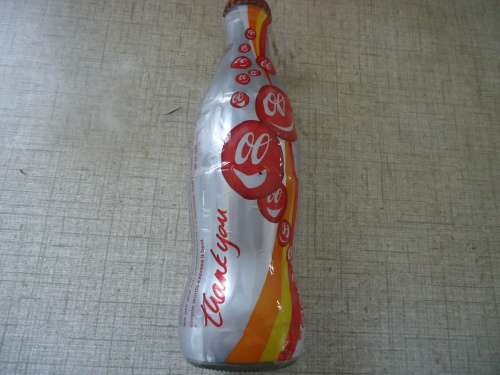 COCA COLA LIMITED EDITION BOTTLE - TO REAL PARTNERSHIPS - THANK YOU BOTTLE FULL GLASS BOTTLE