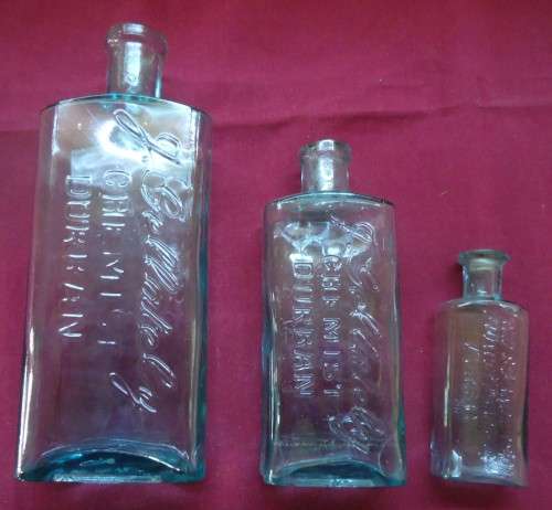 THREE VINTAGE FROSTED GLASS NAME ENGRAVED CHEMIST-APOTHECARY BOTTLES - AS PER PHOTOS