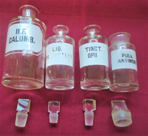 FOUR VINTAGE CLEAR GLASS CHEMIST-APOTHECARY BOTTLES + GLASS STOPPERS & WHITE LABELS  (LOG) SEE PICS