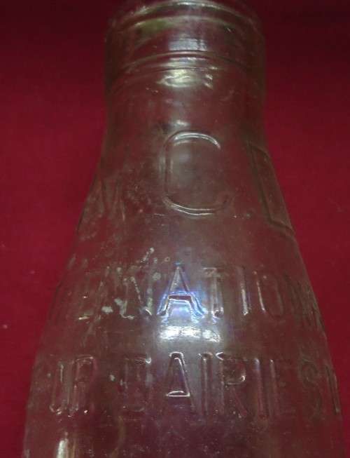 THREE DIFFERENT VINTAGE GLASS MILK BOTTLES -TWO PINT SIZE BOTTLES AND A QUART