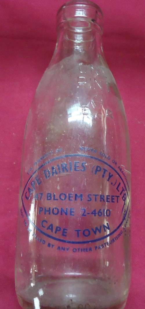 THREE DIFFERENT VINTAGE GLASS MILK BOTTLES -TWO PINT SIZE BOTTLES AND A QUART