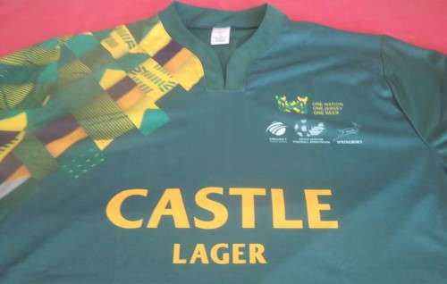 CASTLE LAGER SPRINGBOK SPORTS JERSEY WITH S.A. CRICKET-FOOTBALL-RUGBY LOGOS- IN SIZE XXL