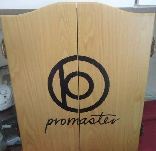 PROMASTER OAK FINISH CABINET-DART BOARD-SCORESHEETS- BOARD CLEANER- 6 DARTS