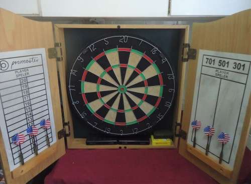PROMASTER OAK FINISH CABINET-DART BOARD-SCORESHEETS- BOARD CLEANER- 6 DARTS