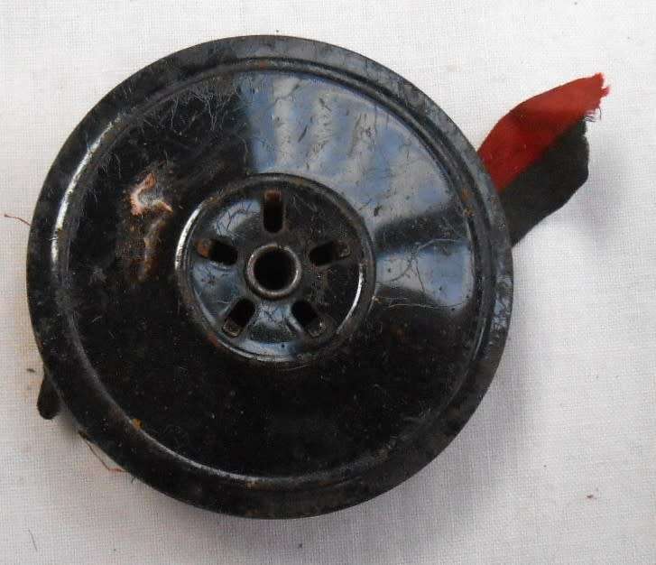 ONE TYPEWRITER REEL WITH OLD RED/BLACK RIBBON