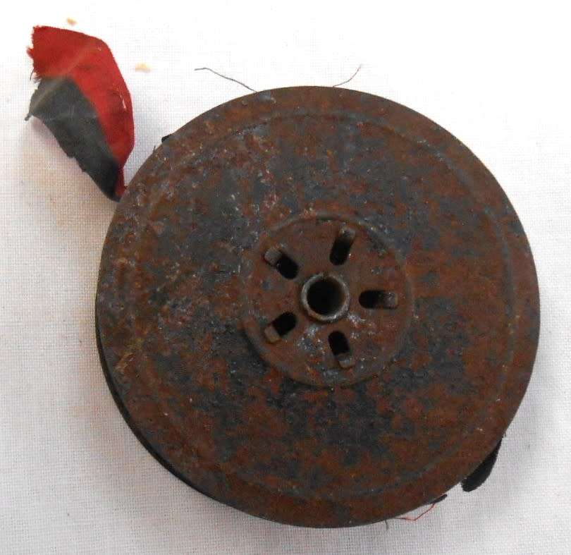 ONE TYPEWRITER REEL WITH OLD RED/BLACK RIBBON