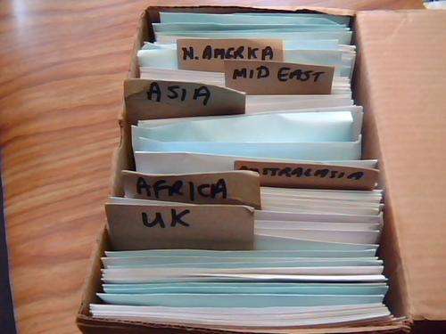 A BOX WITH STAMPS IN ENEVELOPES LOOK SCANS BELOW WOW!!!