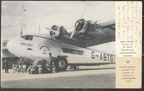 A 1936 EXHIBITION POST CARD SHOWING AIR MAIL UNLOADED AIR MAIL RAND AIR PORT AMALTHEA AIRCRAFT