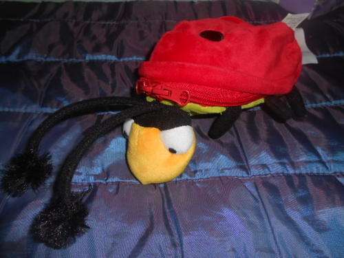 Soft Toy Ladybug with zip and booklet inside.