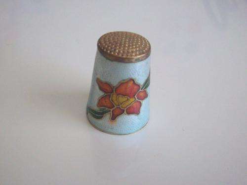 Enamel Singapore souvenir Thimble featuring flower and seahorselion