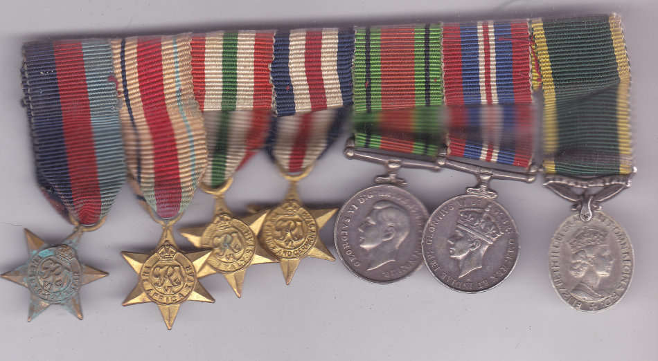 WWII GROUP OF 7 MINIATURES MOUNTED AS WORN- FRANCE GERMANY STAR TERRITORIAL..EFFICIENCY MEDAL ETC