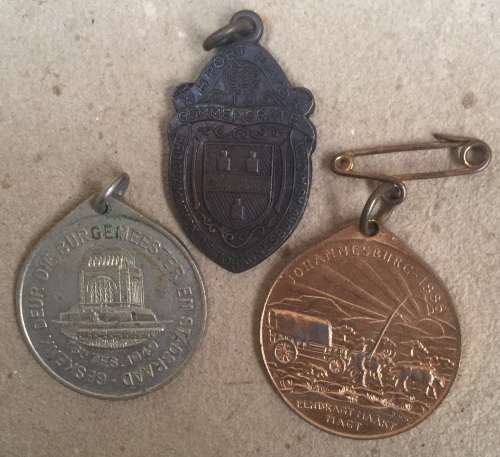 Three medallions issued by Johannesburg....one bid takes all