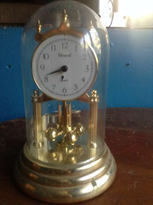 Plastic battery operated glass dome anneversary clock