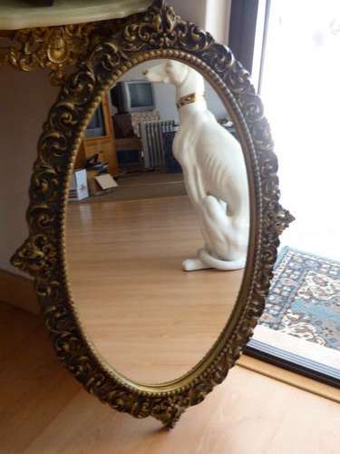 Oblong mirror with ornate frame