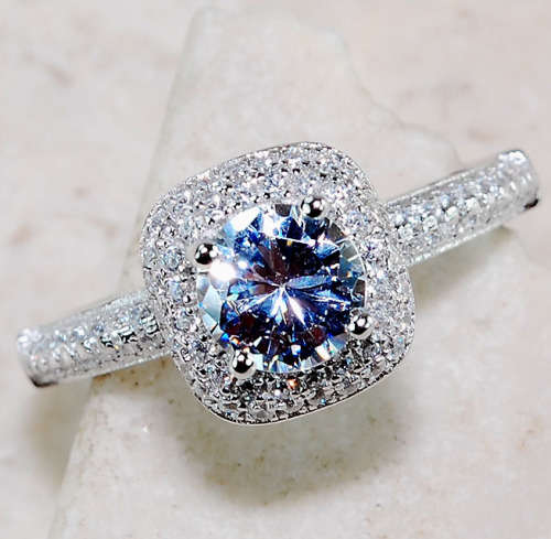 2 CARATS WHITE SAPPHIRE, GENUINE 925 SOLID STERLING SILVER RING SIZE 7. ITEM IS STAMPED 925.