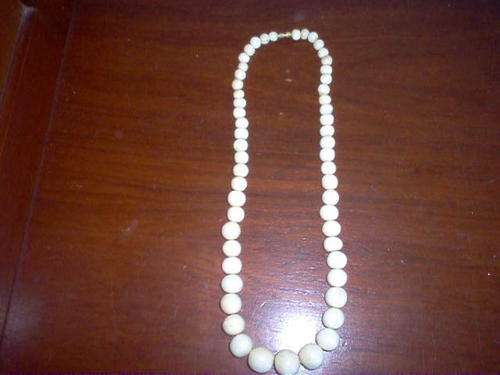 STRING IVORY BEADED NECKLACE.