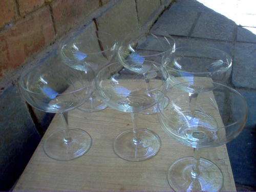 SIX HAND CUT CHAMPAGNE GLASSES IN BOX.