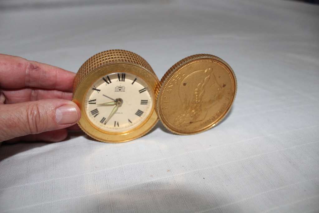 Unusual `coin` alarm clock