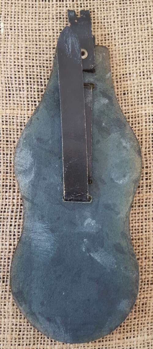 TWO HORSE BRASSES ON A LEATHER STRAP