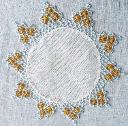VINTAGE WHITE HAND CROCHET DOILY  WITH GREEN GLASS BEADS.