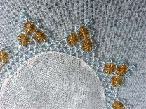 VINTAGE WHITE HAND CROCHET DOILY  WITH GREEN GLASS BEADS.