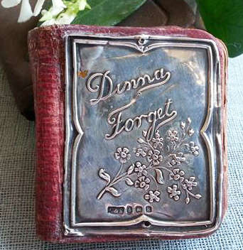 ANTIQUE MINIATURE DIARY WITH A HALL MARKED SILVER FRONT COVER DATED 1908