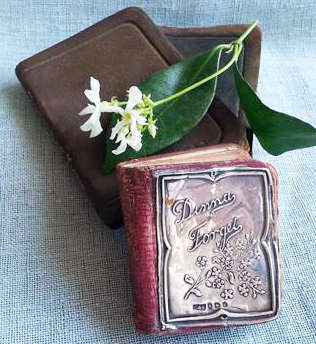 ANTIQUE MINIATURE DIARY WITH A HALL MARKED SILVER FRONT COVER DATED 1908