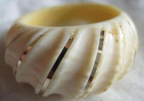 VINTAGE IVORY RING WITH VERY FINE DECORATIVE, GOLD ?  THREADS.