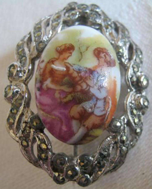 VINTAGE BROOCH, PORCELAIN CENTRE WITH ROMANTIC TRANSFER DESIGN, SURROUNDED WITH MARCASITE.